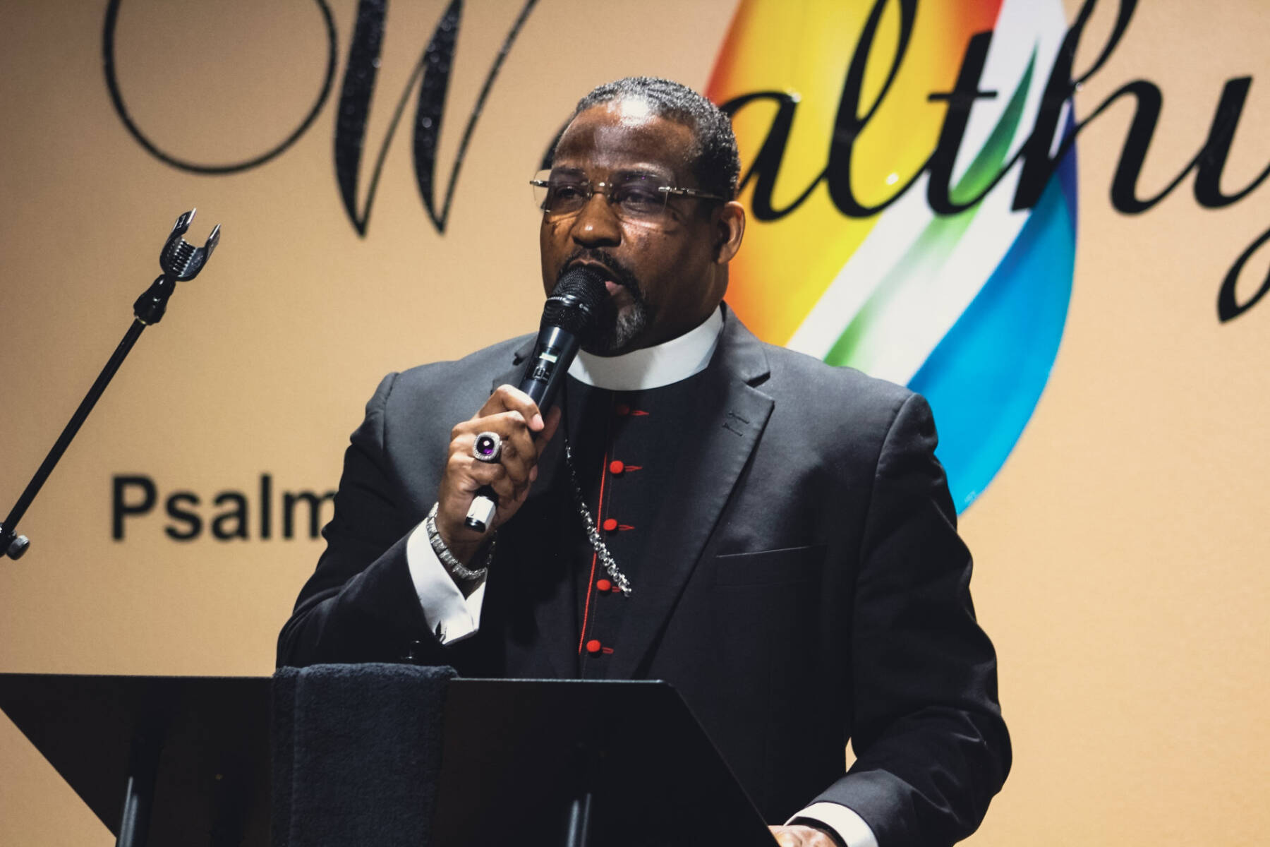 Bishop Derek Rimson speaking at an official Wealthy Place Ministries service
