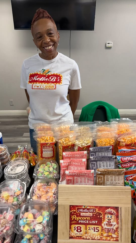 Jamella Brown at an official Wealthy Place Ministries vendor spotlight with Mella B's popcorn and snack products